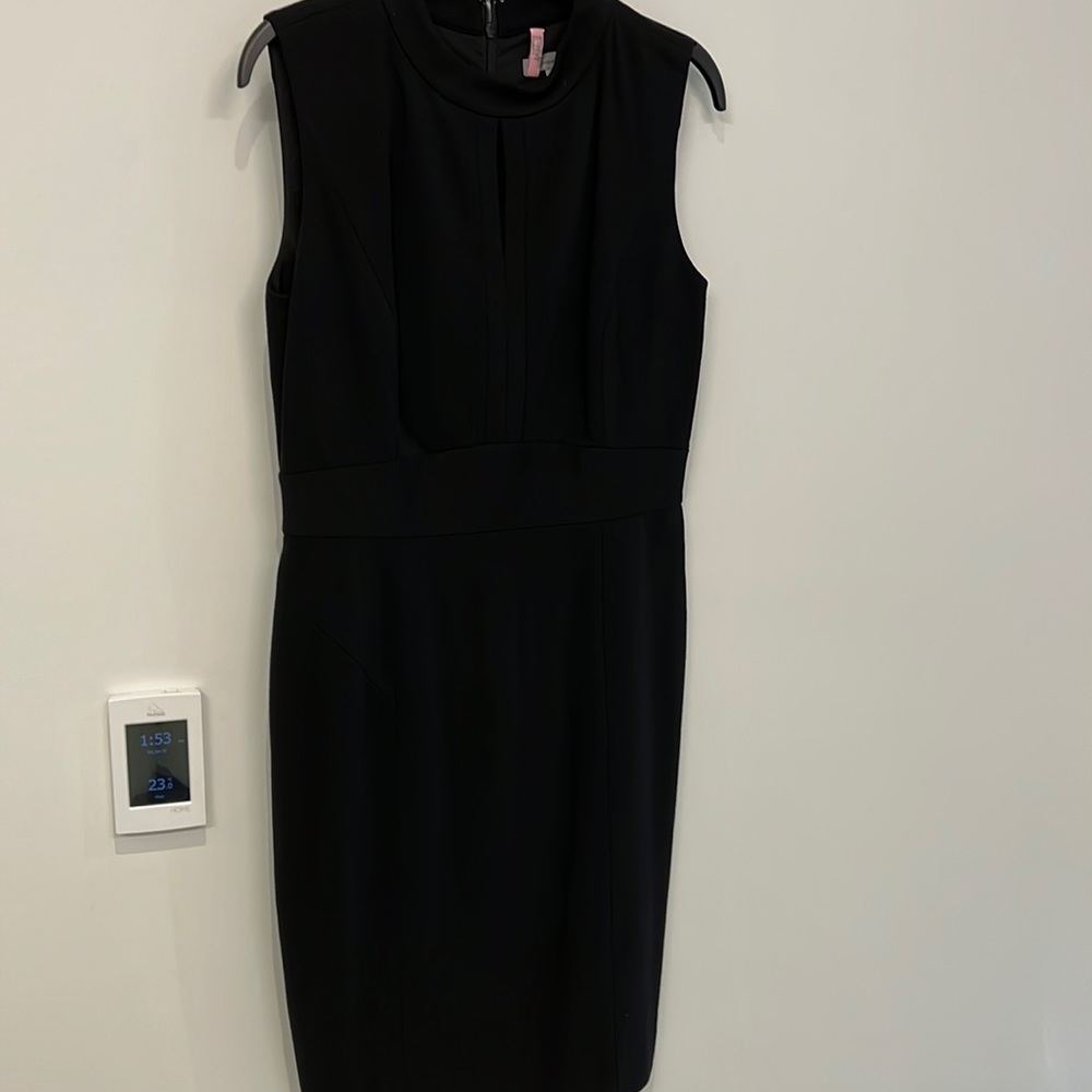 Black dress from Nordstrom size 6. MIDI with key hole at neck line.